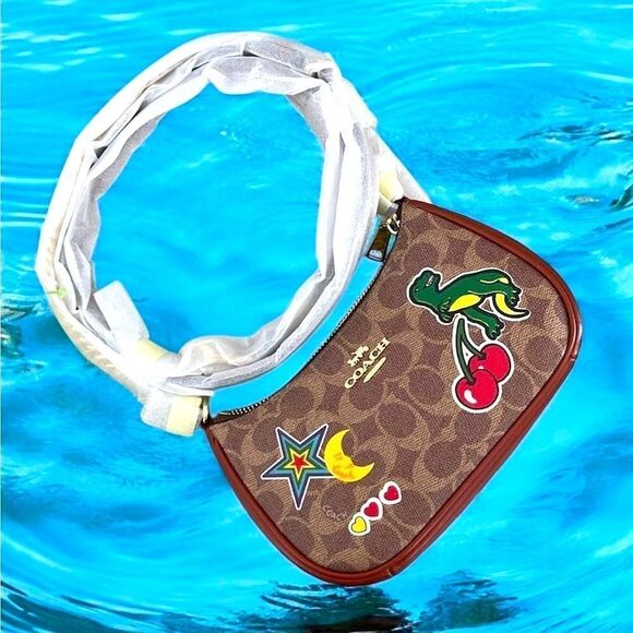 Coach Handbags - Coach Teri Mini Crossbody Bag In Signature Canvas With Sticker Print Rexy Purse